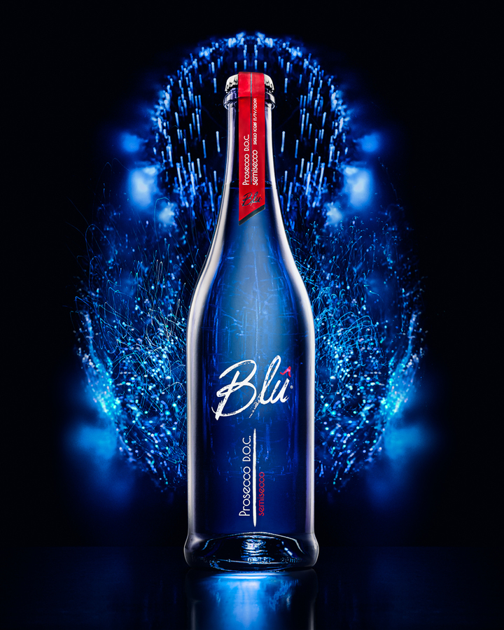Bottle of Blu Prosecco D.O.C. with abstract lights in the background